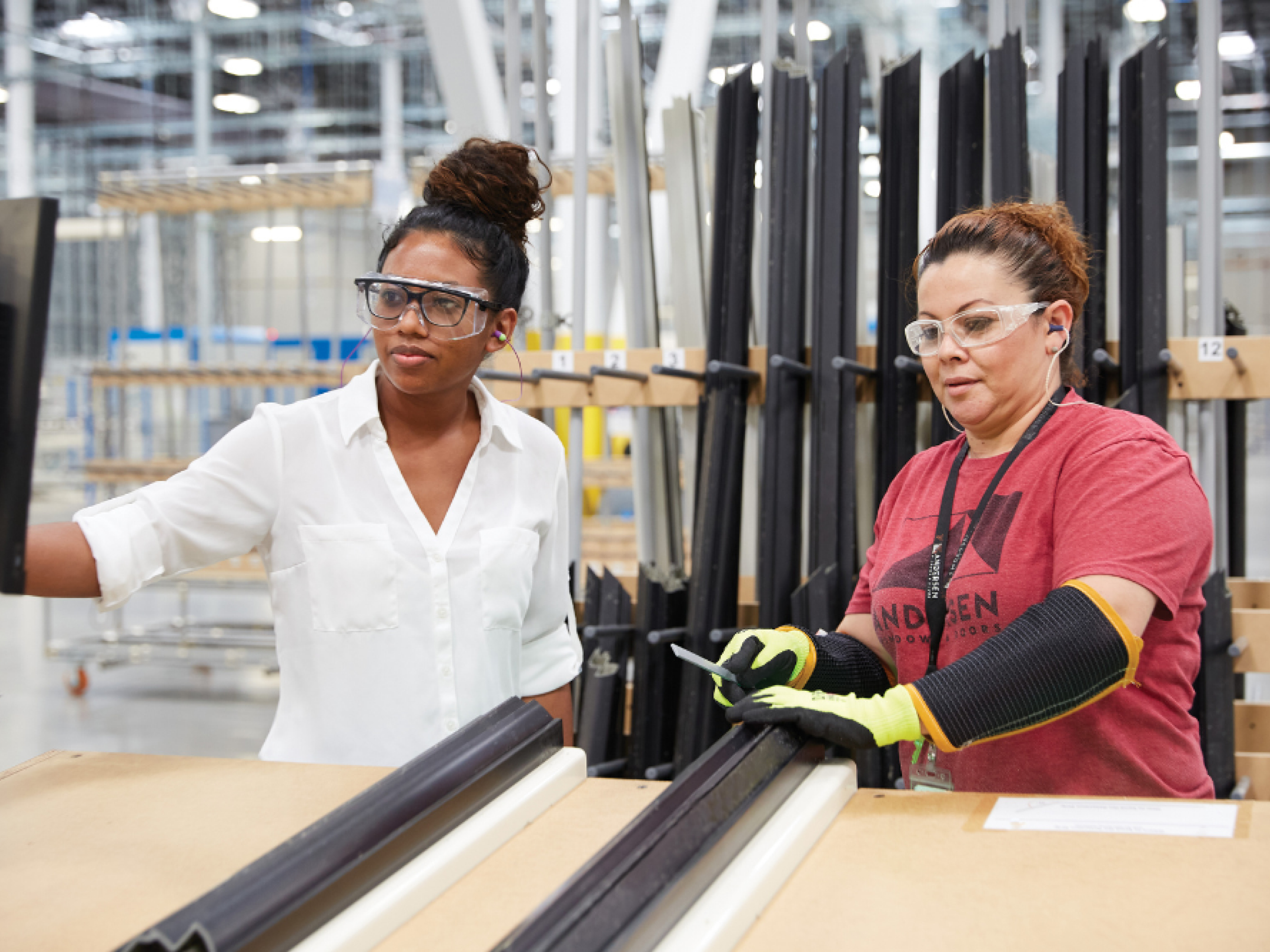 Handling professionals packaging finished products for distribution.