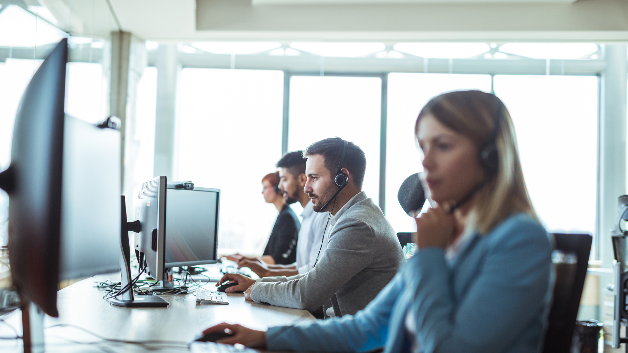 Renewal by Andersen Call Center agents talking with homeowners to schedule in home consultations for windows/doors replacement