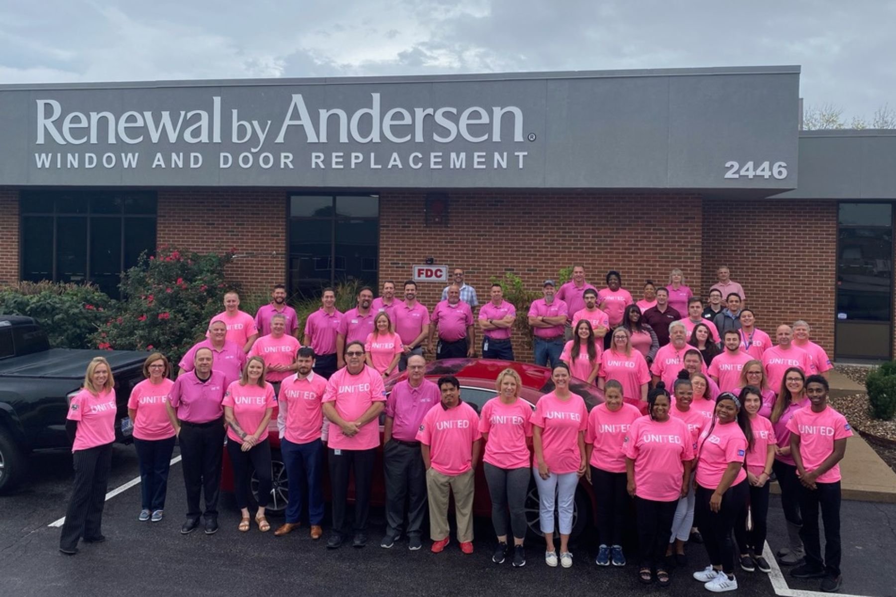 Group of RbA employees wearing Pink "United Against Cancer" t-shirts in support of ACS event.