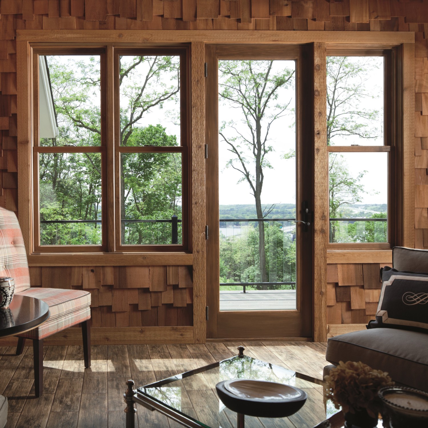 An inswing patio door with one panel. The door is wood tone and blends in to nature.