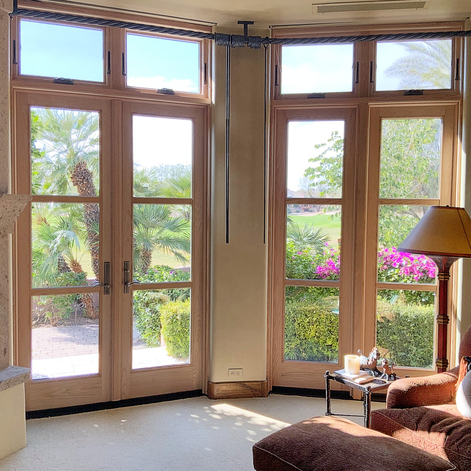 A series hinged inswing doors with unique equal lite grilles that match the surrounding windows. 