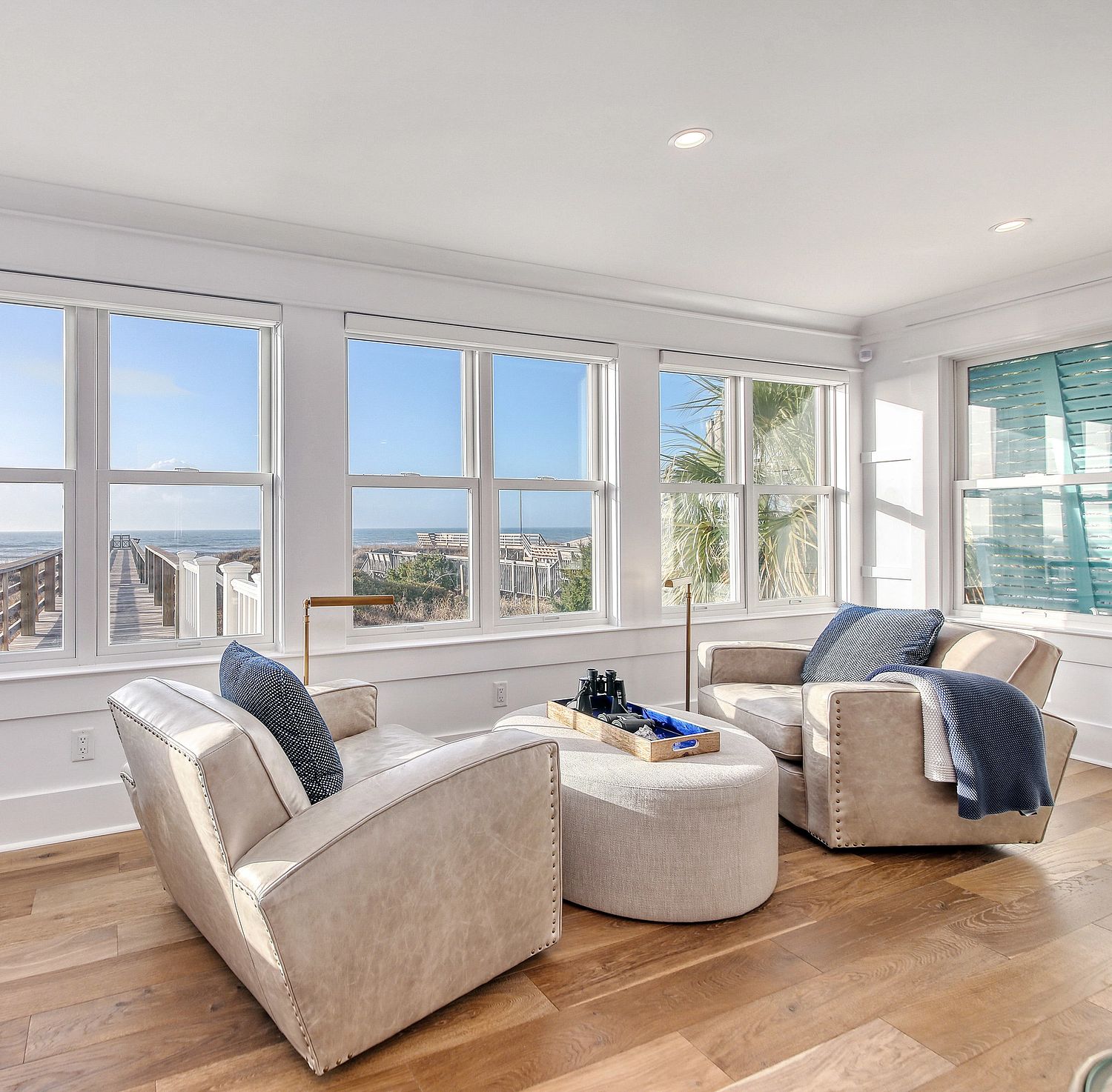 A sunroom with double hung windows.